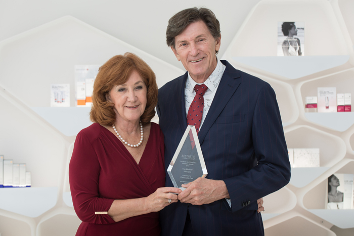 Dr Des and Val holding an Environ award