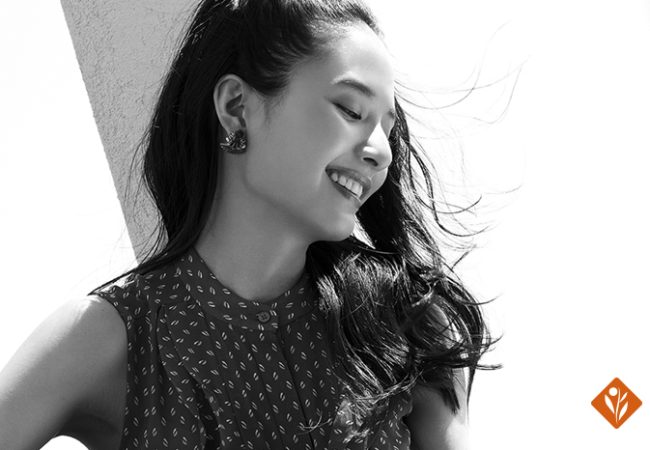 Black and white image of a smiling woman