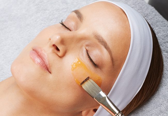 laid down woman's face treated to a facial