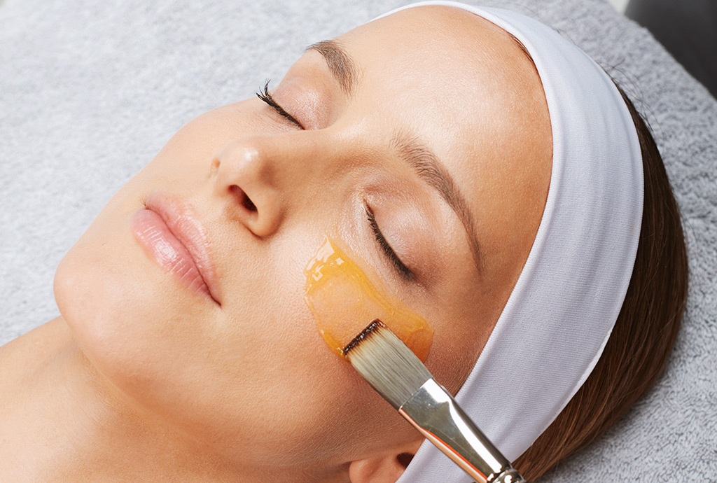 laid down woman's face treated to a facial