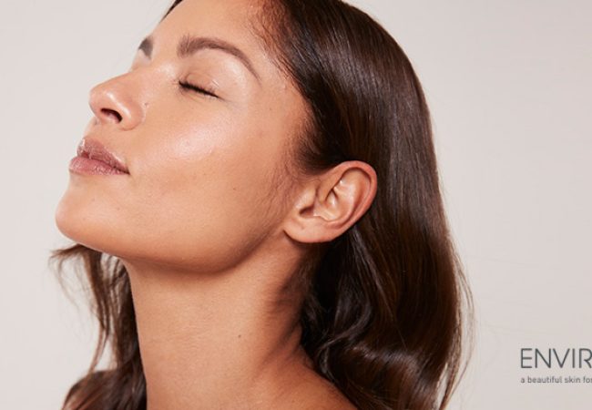 a woman's face with closed eyes and an Environ logo on the bottom right