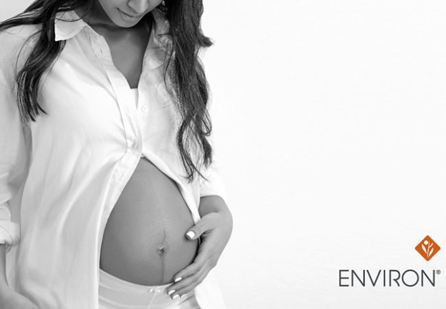 black and white image of a pregnant woman