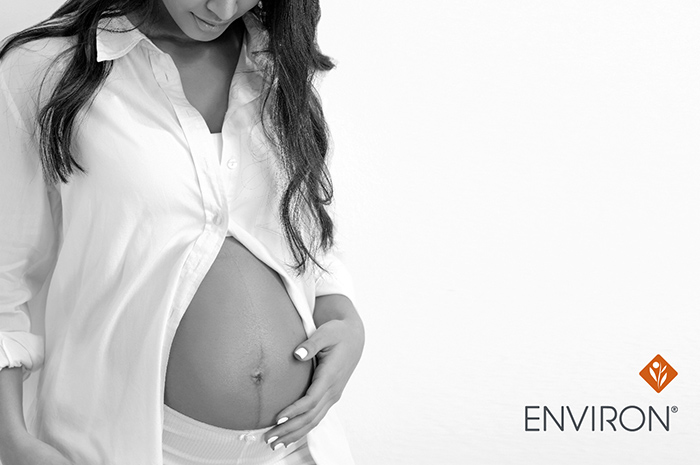 black and white image of a pregnant woman