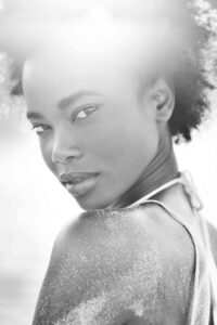 Black and white image of a woman with afro hair